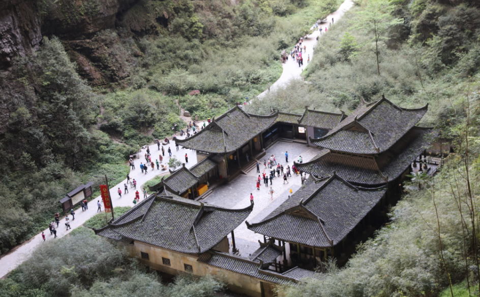Tianfu Official Post surrounded by limestone cliffs in Wulong